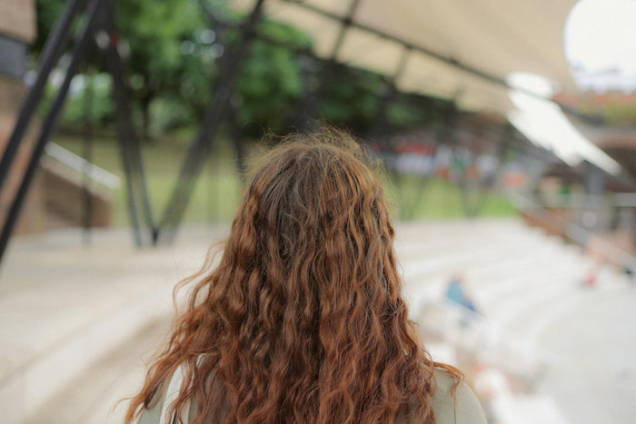 Woman with type 2C wavy-to-curly hair