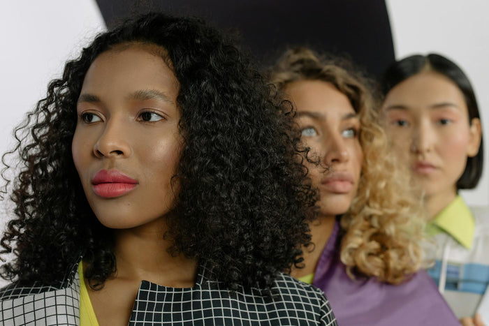 Diverse women showcasing different natural curl types and textures