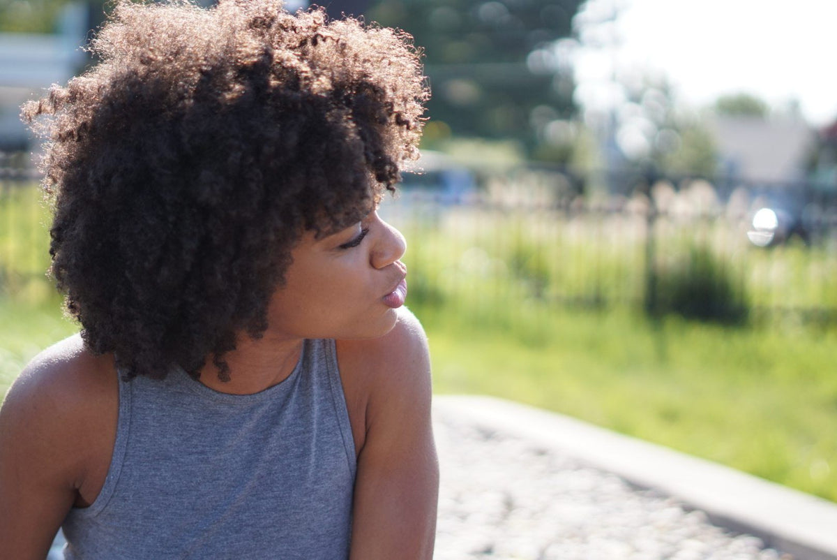 Person with type 4 coily natural afro hair